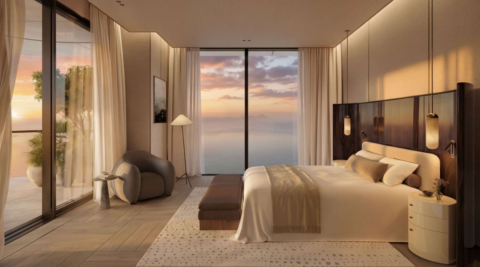 Rosewood bedroom opening toward the sea at sunset